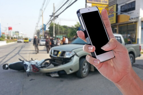 A person is calling a lawyer after a car accident.