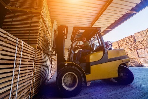 A driver manuevers a lift truck unsafely which can lead to a common type of accident.