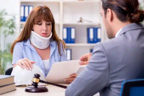 A woman with a traumatic brain injury talks about disability qualifications with her lawyer.
