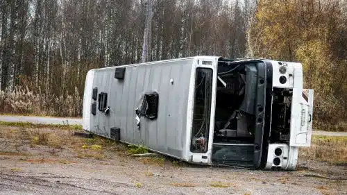 An overturned bus after a public transportation accident.