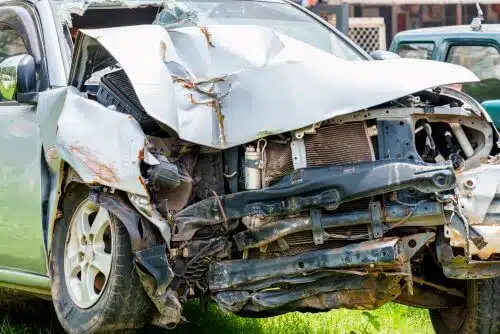 The mangled front in of a vehicle after a car accident that caused a wrongful death.