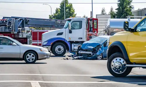 A traffic jam caused by an uninsured motorist accident at an intersection.